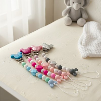 Attache- tétine-variés