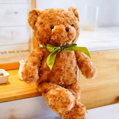 Ours- en -peluche - Cali -brun-assis