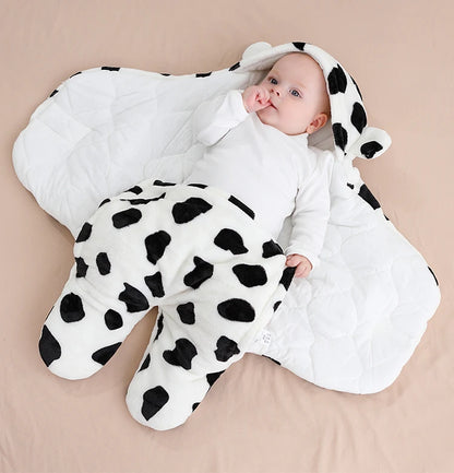 bébé dans nid d'ange peau de vache