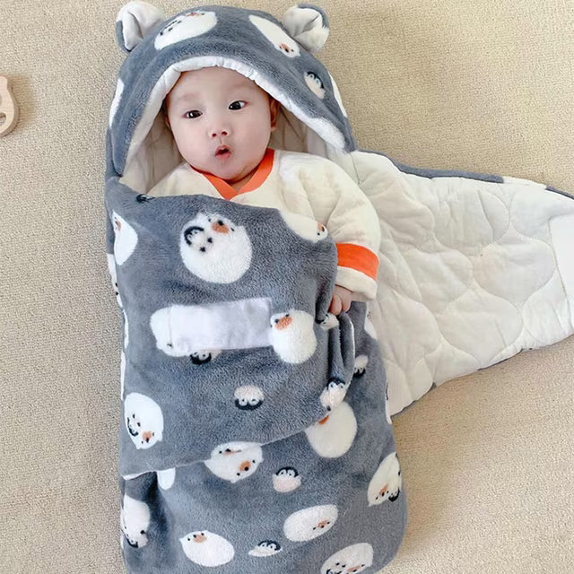 bébé dans son nid d'ange cosy