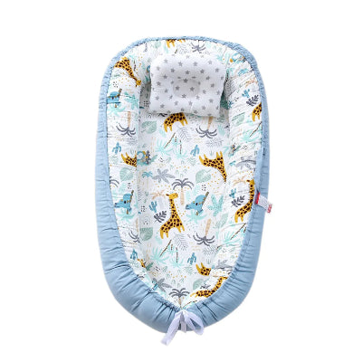 bebe-reducteur-de-lit-girafe-bleu