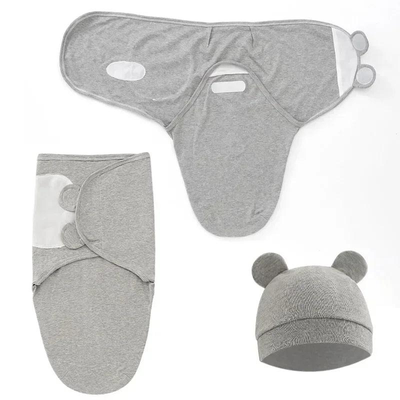 emmaillotage-bébé-gris-avec-son-chapeau