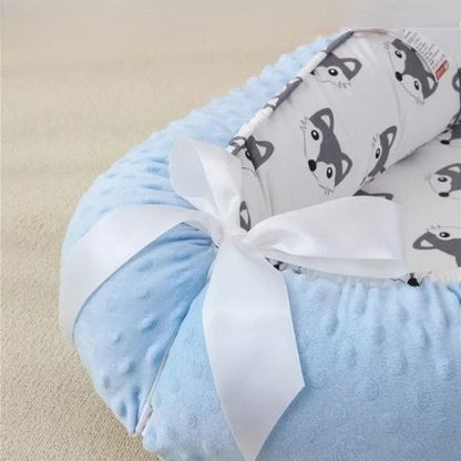 reducteur-de-lit-bebe-ouvre-aux-pieds