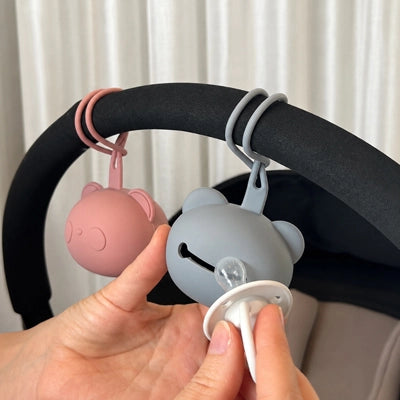 sucette bebe accrohé à la poussette
