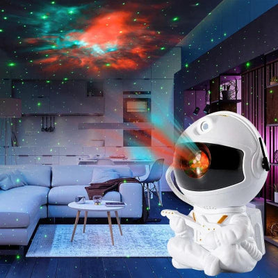 veilleuse projection astronaute assis avec une guitare qui projette un ciel étoilé sur le plafond du salon